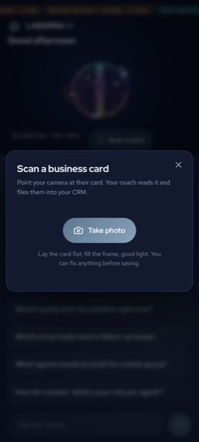 Scan a business card inside the Coach — point the camera and it reads the card